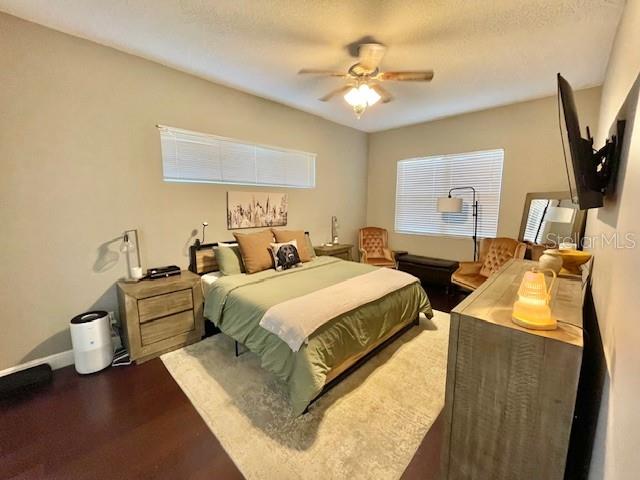 226 River Village Drive DeBary, FL 32713 - Photo 18 of 27 a spacious bedroom with two beds and a chandelier