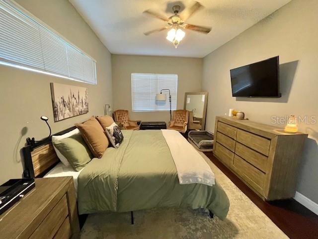 226 River Village Drive DeBary, FL 32713 - Photo 19 of 27 a bedroom with a bed and a flat screen tv