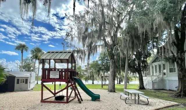 a view of a park with swings and slides