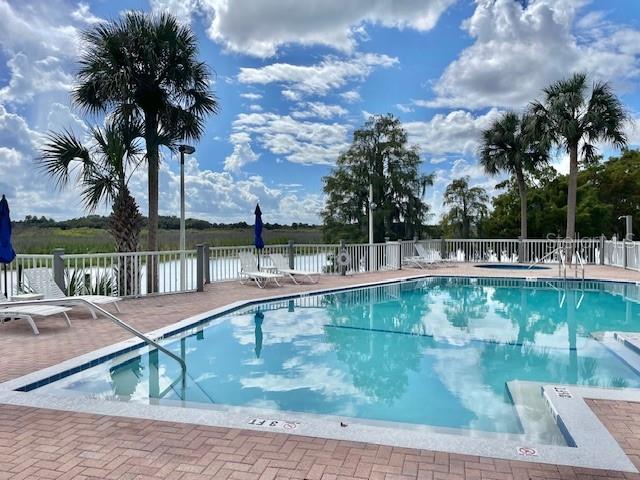 226 River Village Drive DeBary, FL 32713 - Photo 24 of 27 a view of swimming pool with a garden