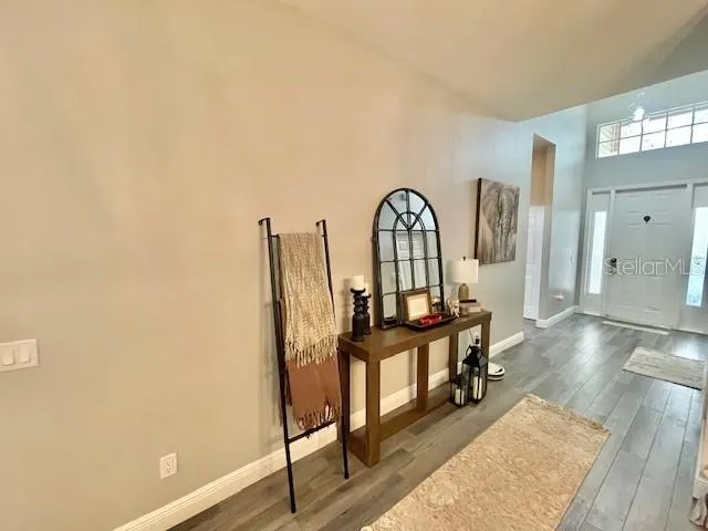 a view of a livingroom with furniture and staircase
