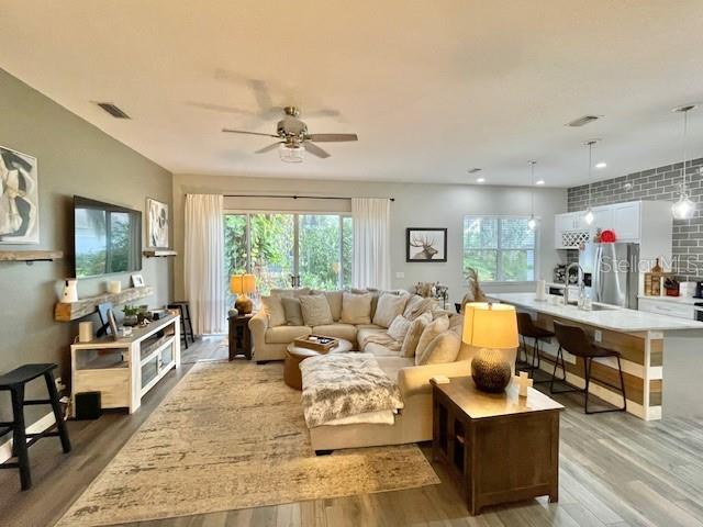 226 River Village Drive DeBary, FL 32713 - Photo 10 of 27 a living room with furniture and a large window