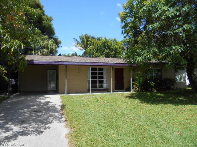 1419 Mandel Road Fort Myers, FL 33919 - Photo 1 of 18 front view of a house with a yard