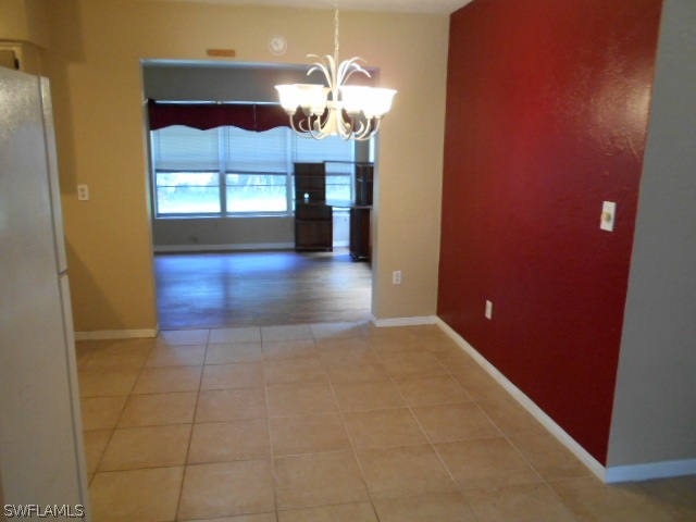 1419 Mandel Road Fort Myers, FL 33919 - Photo 6 of 18 a view of a kitchen with a sink and a chandelier