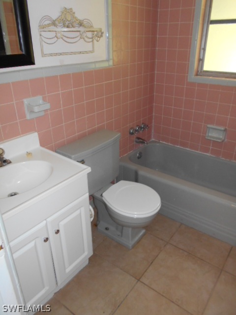 1419 Mandel Road Fort Myers, FL 33919 - Photo 10 of 18 a white toilet sitting next to a bathroom sink