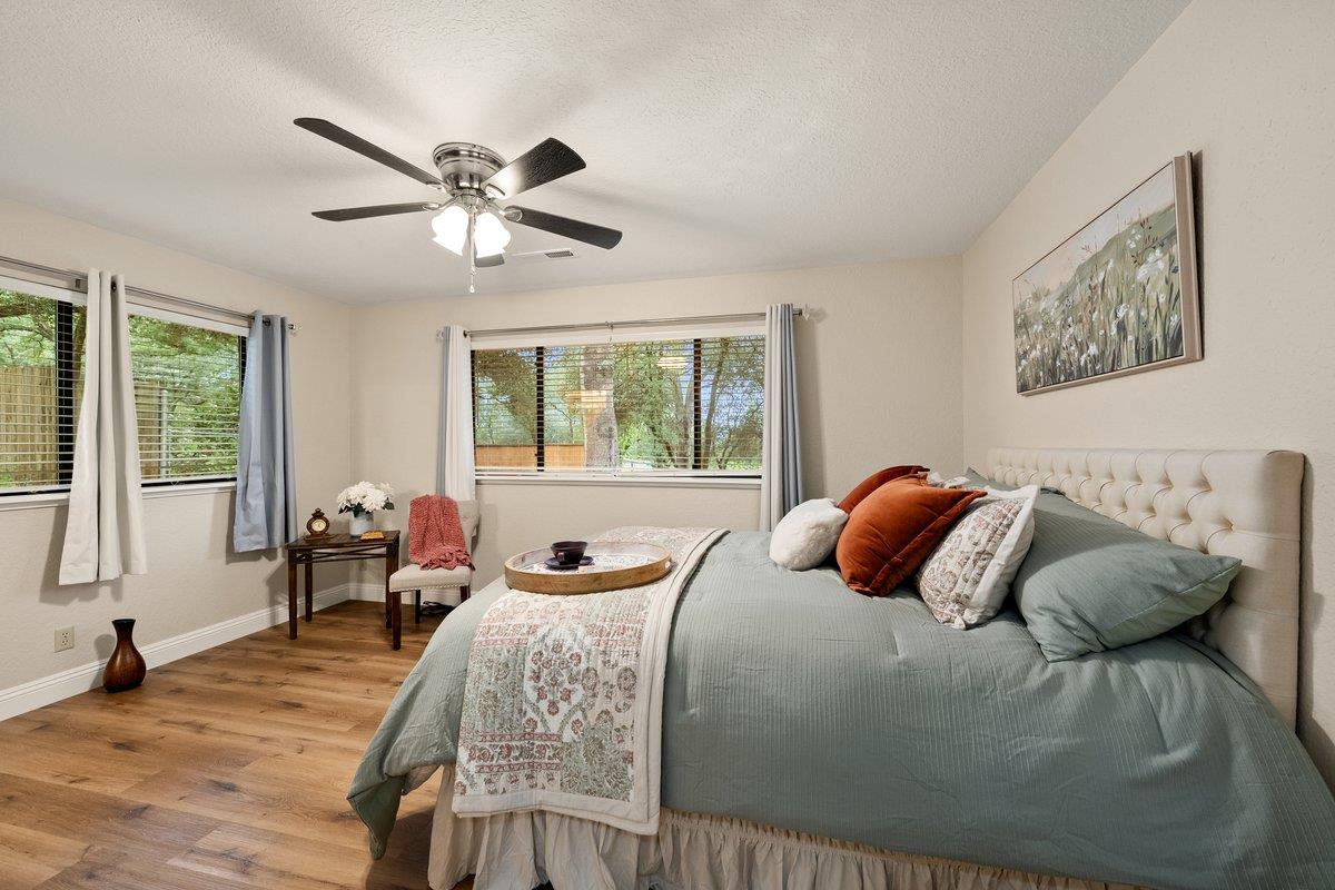 6561 Trinity Way Placerville, CA 95667 - Photo 19 of 58 a bedroom with a bed and wooden floor