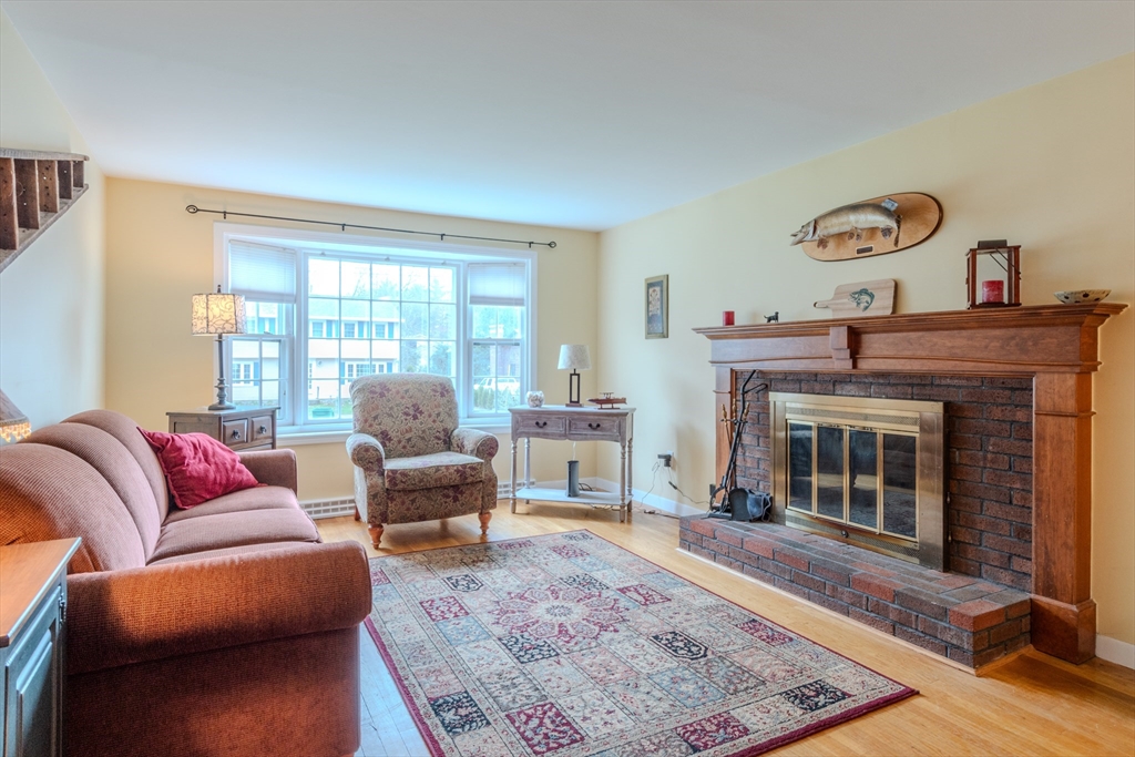 21 Nova Road Nashua, NH 03064 - Photo 12 of 30 a living room with furniture and a fireplace