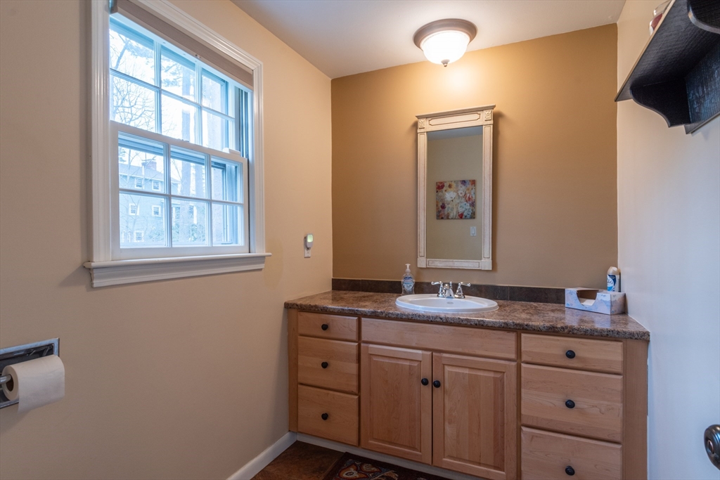 21 Nova Road Nashua, NH 03064 - Photo 14 of 30 a bathroom with a sink and a mirror