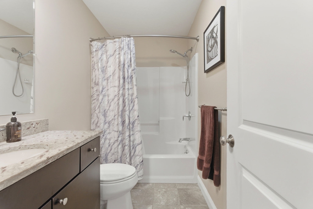 66 Compass Point, Unit 66 North Andover, MA 01845 - Photo 37 of 42 a bathroom with a granite countertop sink toilet and shower