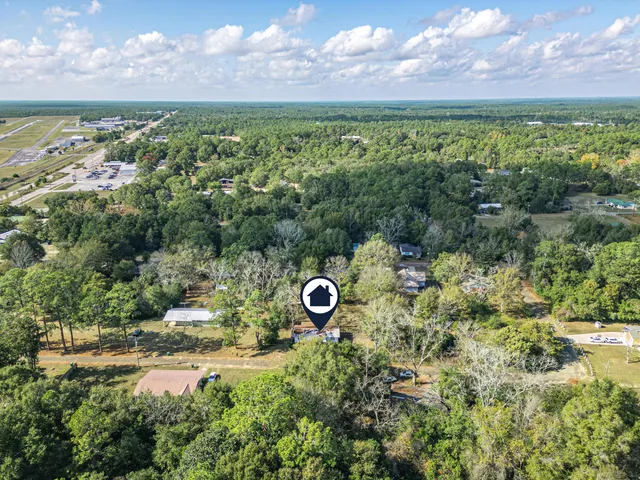 a view of a field with an ocean