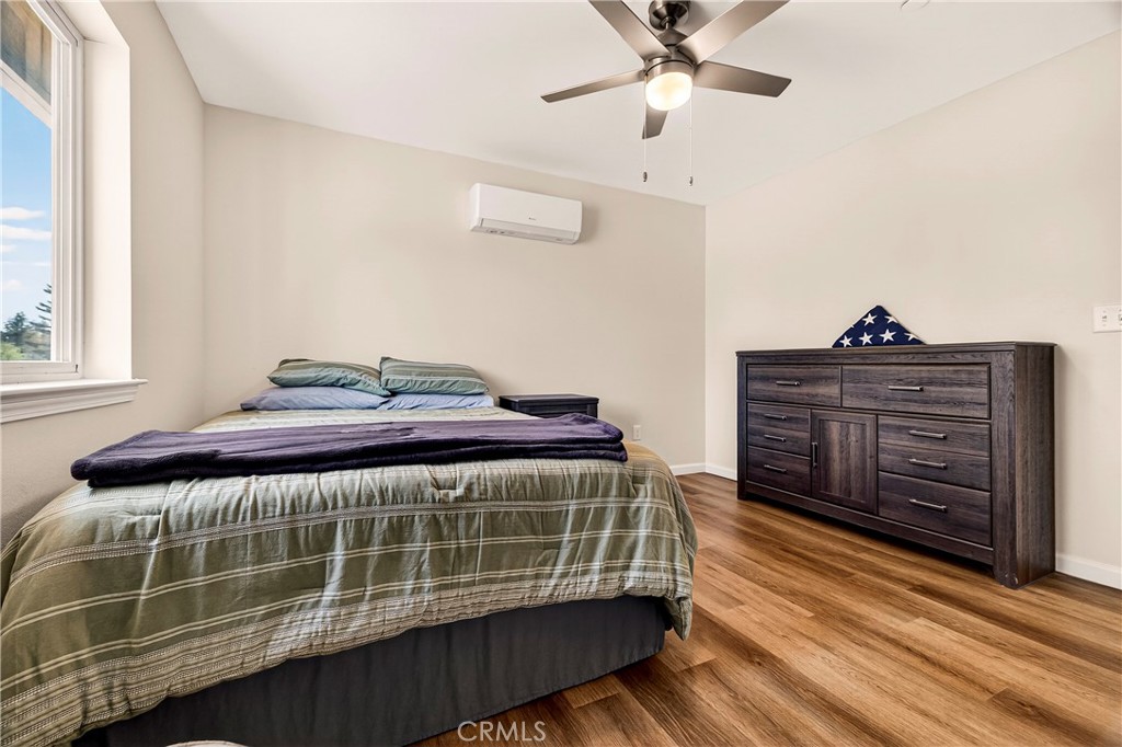 6352 Tahoe Court Paradise, CA 95969 - Photo 20 of 61 a bedroom with a bed and wooden cabinets
