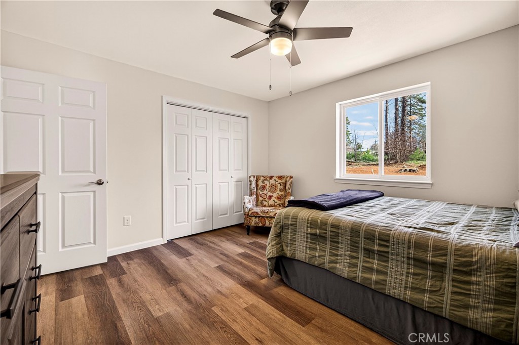 6352 Tahoe Court Paradise, CA 95969 - Photo 21 of 61 a bedroom with a bed and wooden floor