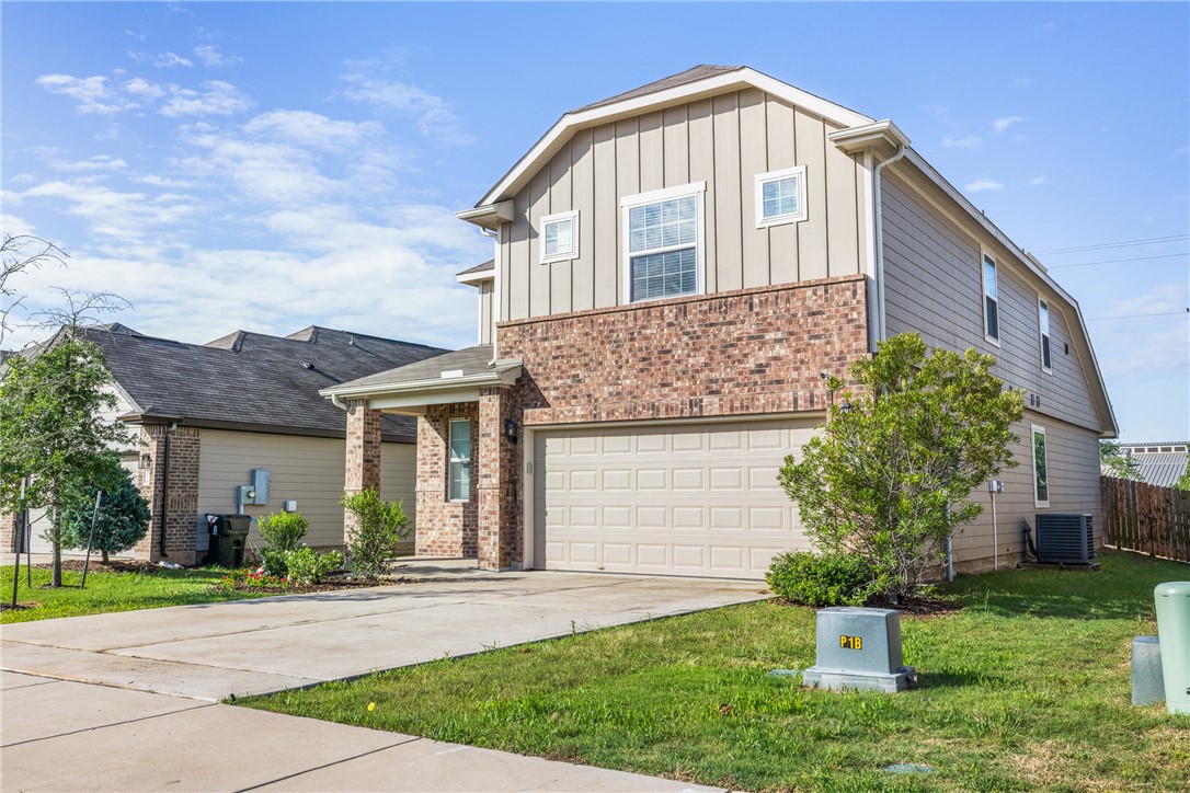 4702 Nopalitos Way Bryan, TX 77807 - Photo 1 of 27 a front view of a house with a yard