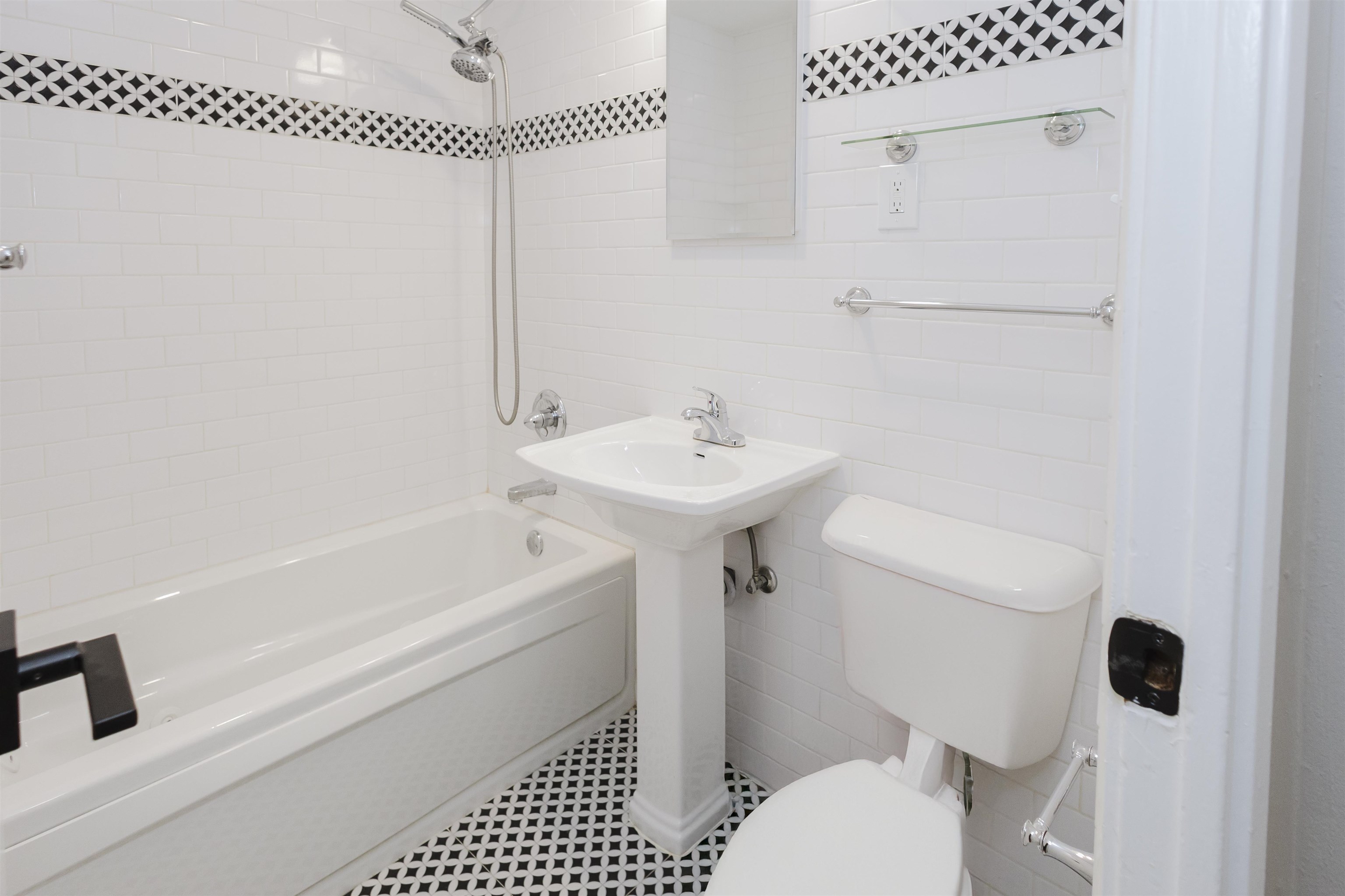 421 McDermitt Road Memphis, TN 38120 - Photo 14 of 23 a bathroom with a sink a toilet and shower