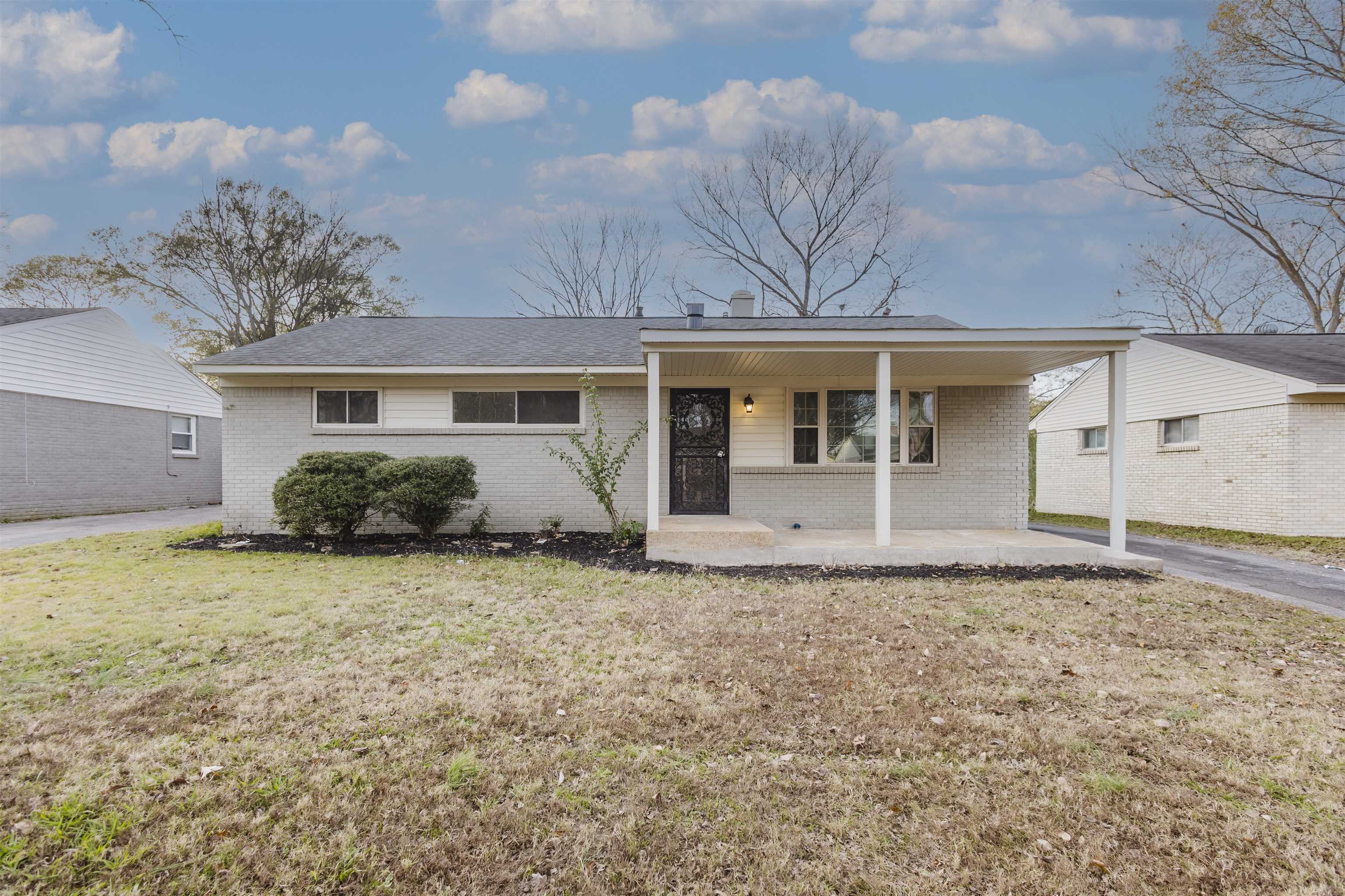 421 McDermitt Road Memphis, TN 38120 - Photo 2 of 23 a front view of a house with garden