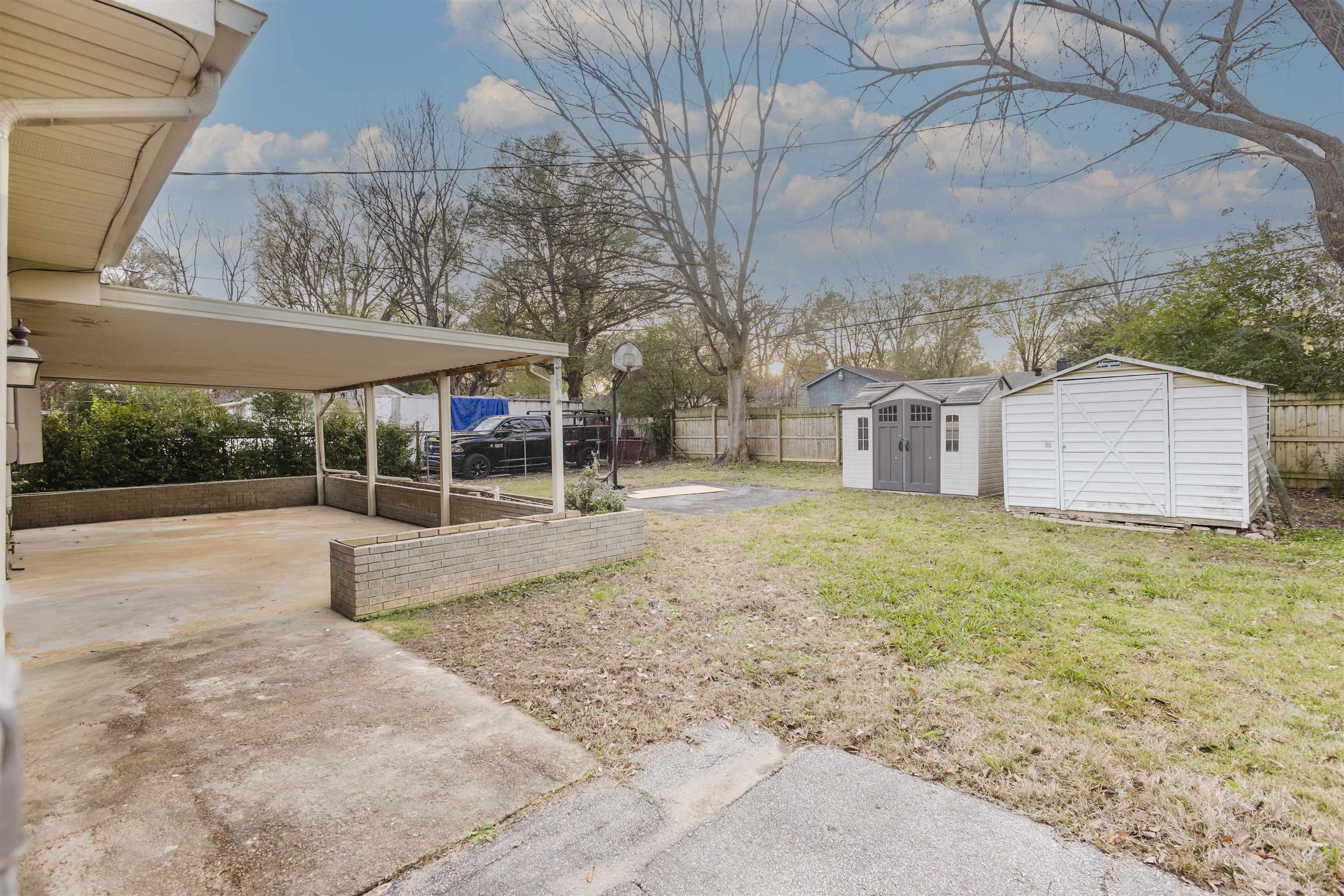 421 McDermitt Road Memphis, TN 38120 - Photo 22 of 23 a view of a yard with a tree