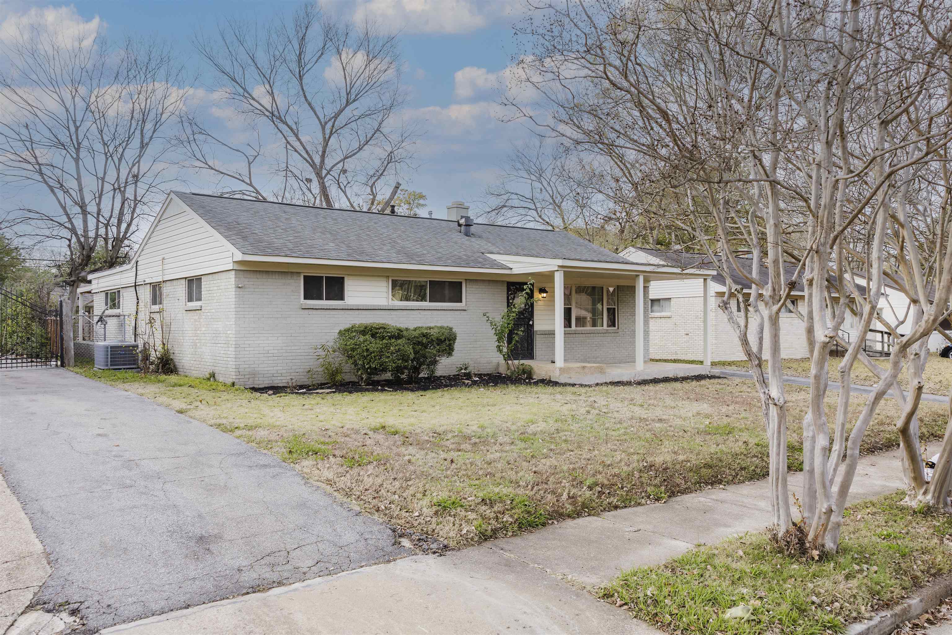 421 McDermitt Road Memphis, TN 38120 - Photo 3 of 23 a view of a house with a yard covered in snow
