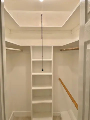 a bathroom with a shower and a glass door