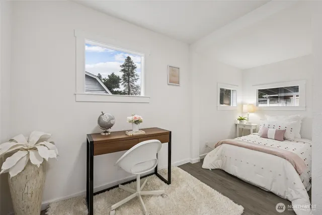 a bedroom with a bed and a table in it