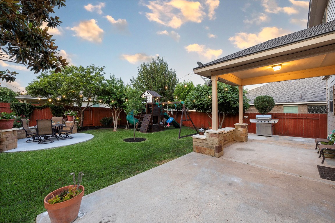 a view of a backyard with sitting area