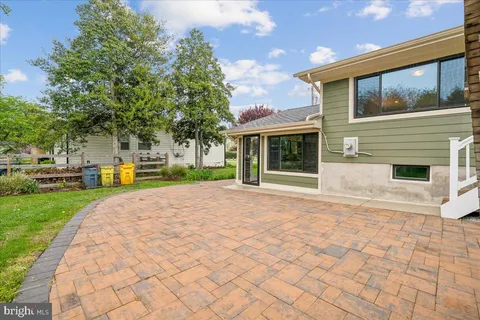 a swimming pool with outdoor seating and yard