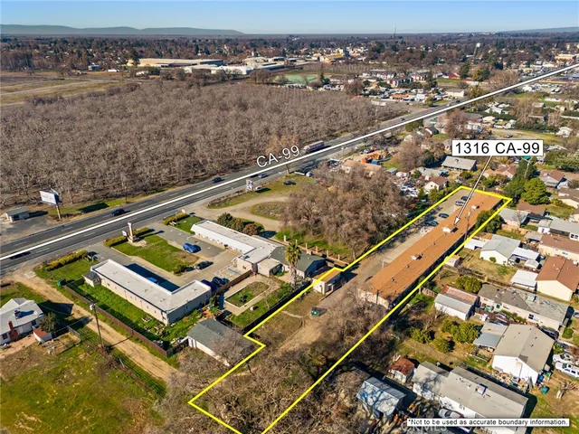 an aerial view of residential houses with outdoor space