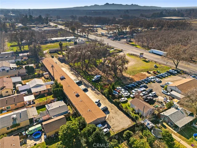 an aerial view of residential houses with outdoor space