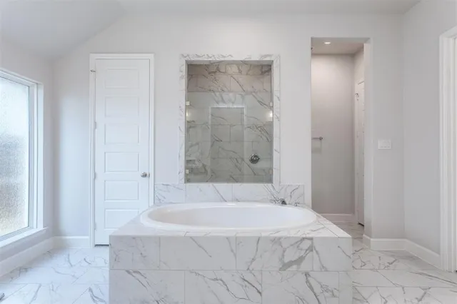 a living room with furniture and large window