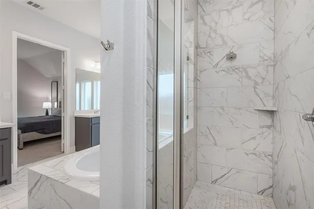 a large bathroom with a double vanity sink mirror and toilet