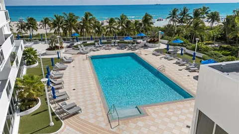 a view of a swimming pool with a patio