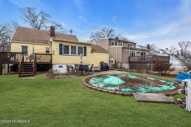 a front view of a house with a garden and plants