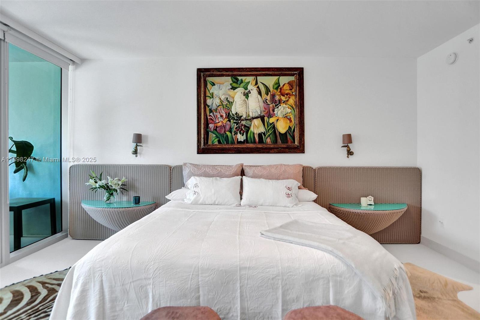 2627 South Bayshore Drive, Unit 506 Coconut Grove, FL 33133 - Photo 24 of 61 a bedroom with a bed and a painting on the wall