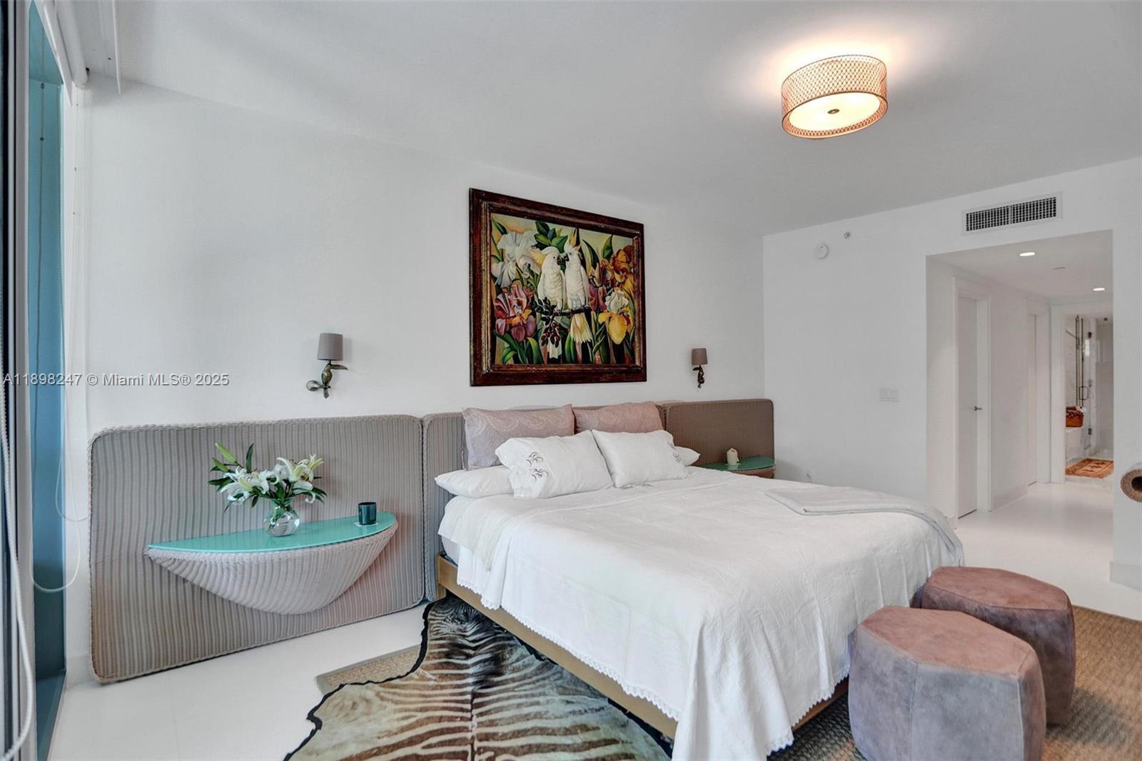 2627 South Bayshore Drive, Unit 506 Coconut Grove, FL 33133 - Photo 26 of 61 a bed room with a bed and a couch