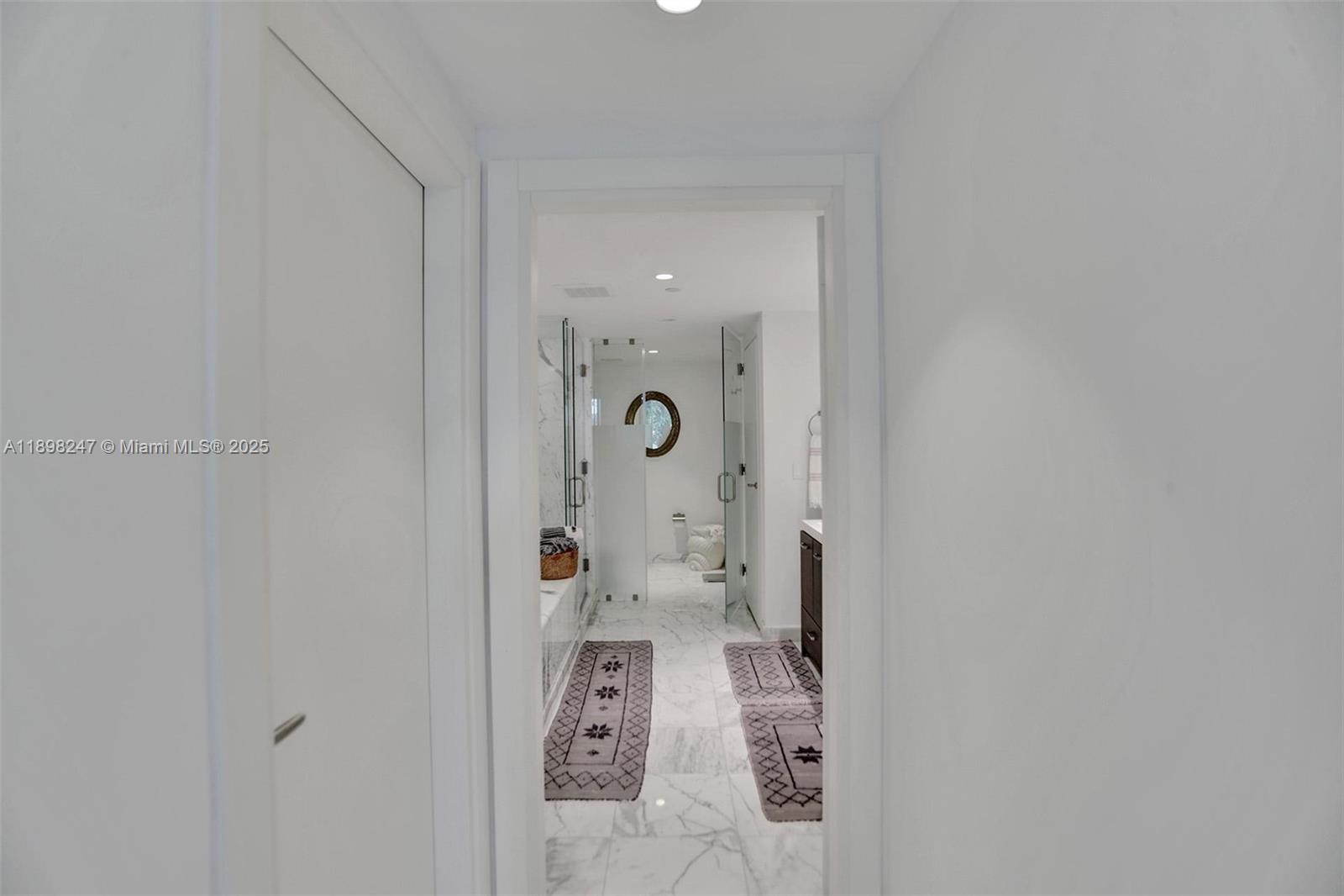 2627 South Bayshore Drive, Unit 506 Coconut Grove, FL 33133 - Photo 28 of 61 wooden floor in a white room