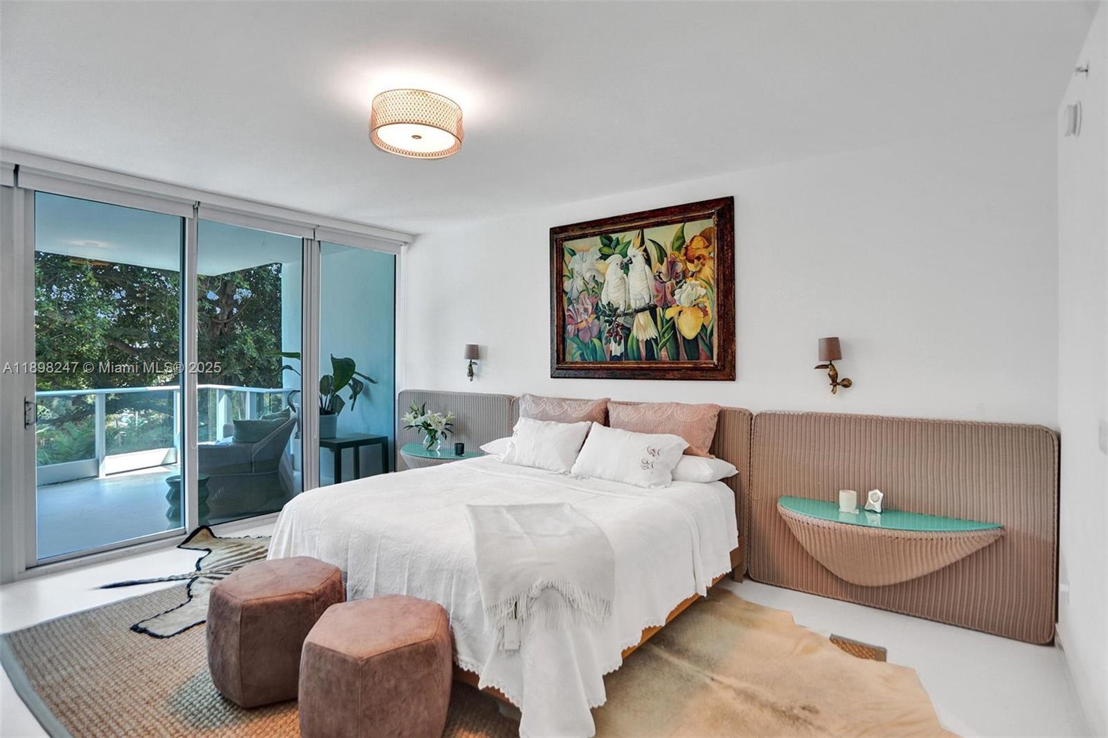 2627 South Bayshore Drive, Unit 506 Coconut Grove, FL 33133 - Photo 3 of 61 a bed room with a bed and a window