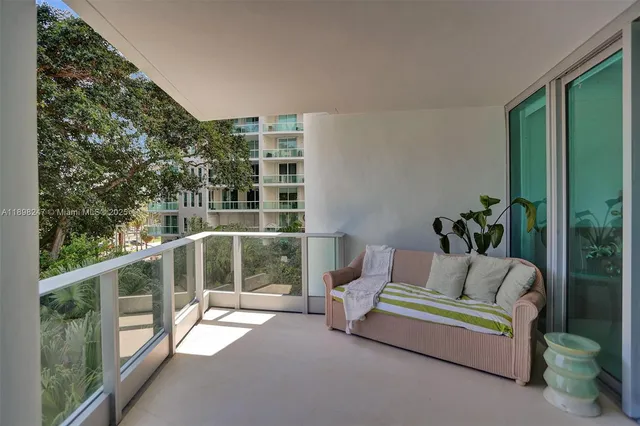 a living room with furniture a window and kitchen view