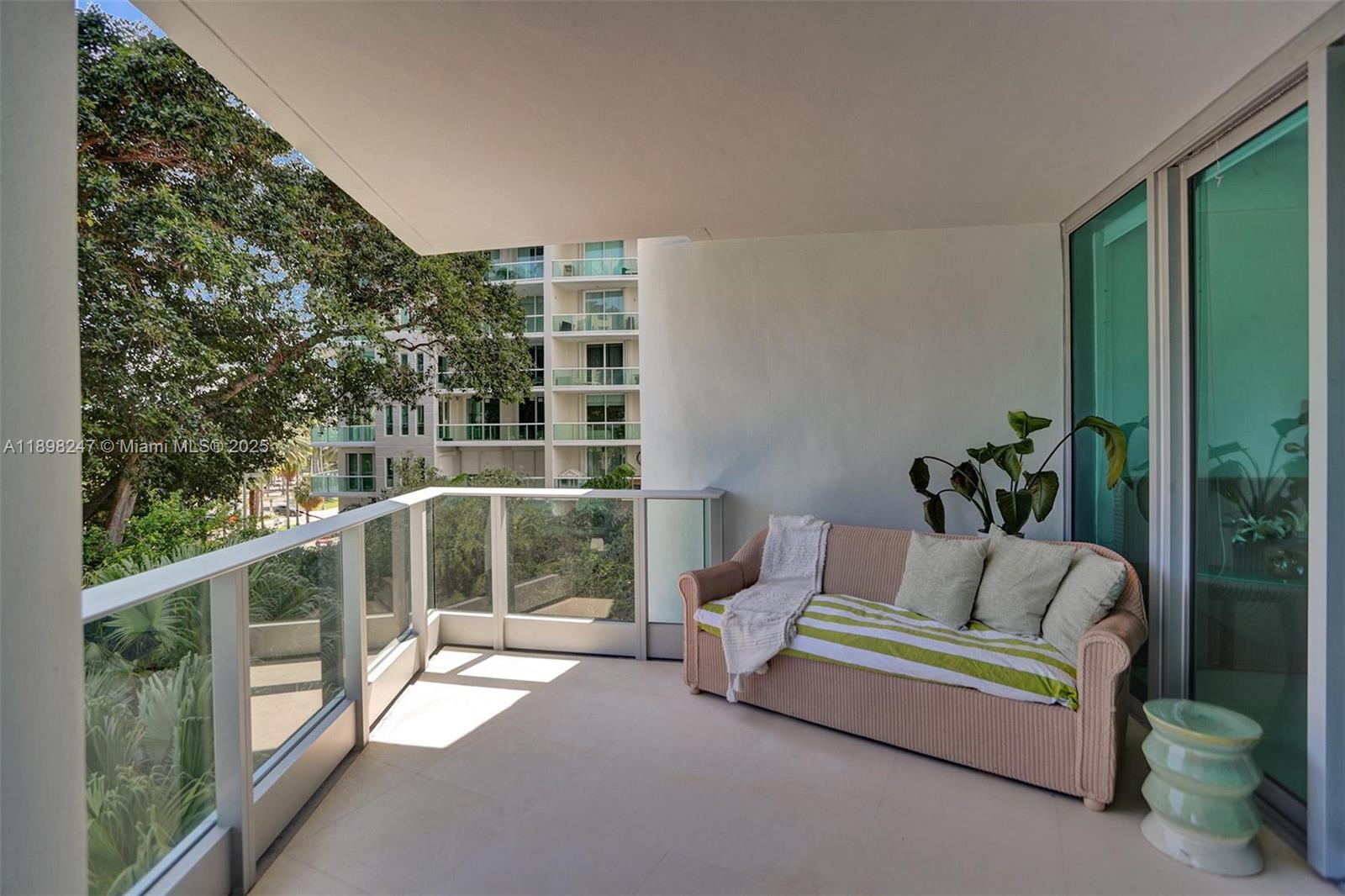 2627 South Bayshore Drive, Unit 506 Coconut Grove, FL 33133 - Photo 43 of 61 a living room with furniture and a window
