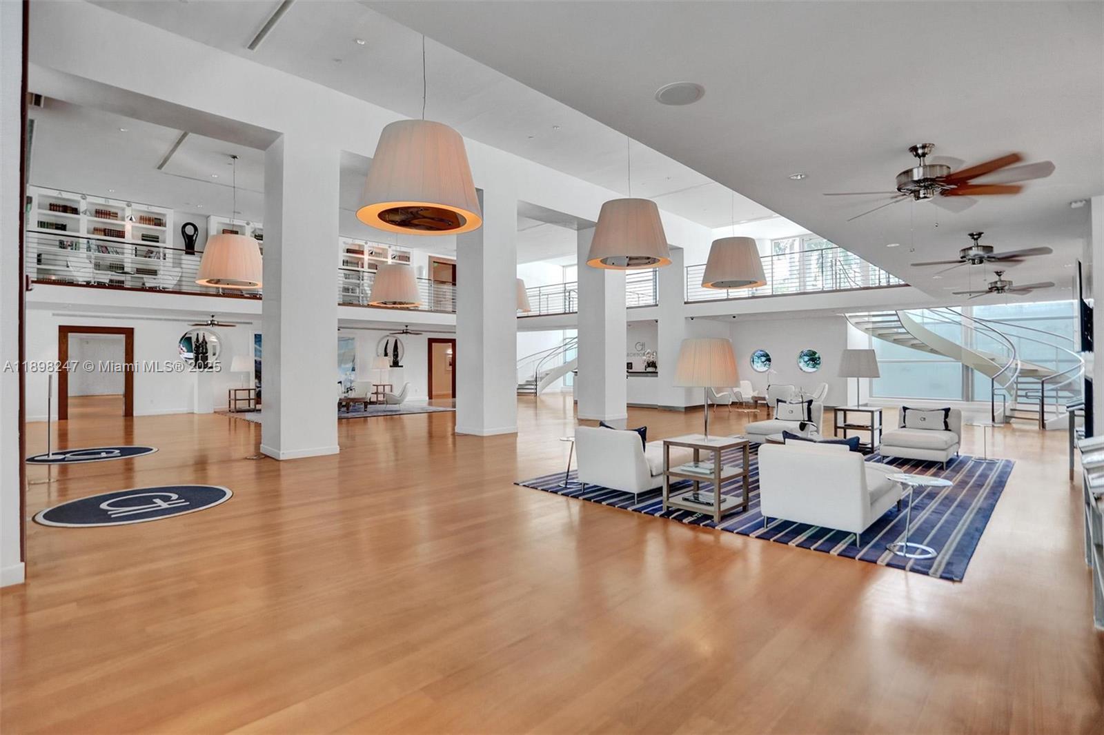 2627 South Bayshore Drive, Unit 506 Coconut Grove, FL 33133 - Photo 48 of 61 a living room with furniture and wooden floor