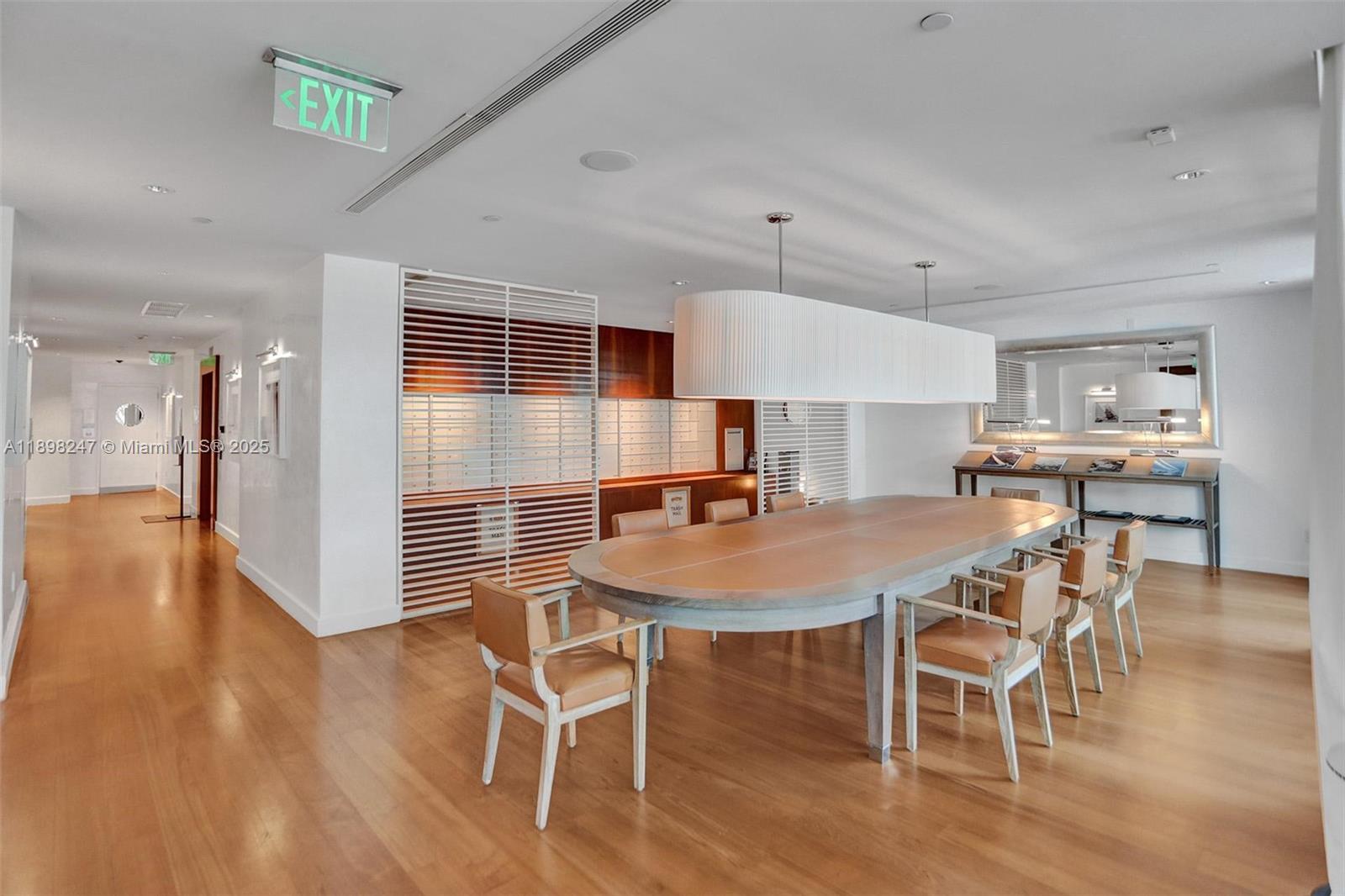 2627 South Bayshore Drive, Unit 506 Coconut Grove, FL 33133 - Photo 52 of 61 a dining room with furniture and wooden floor