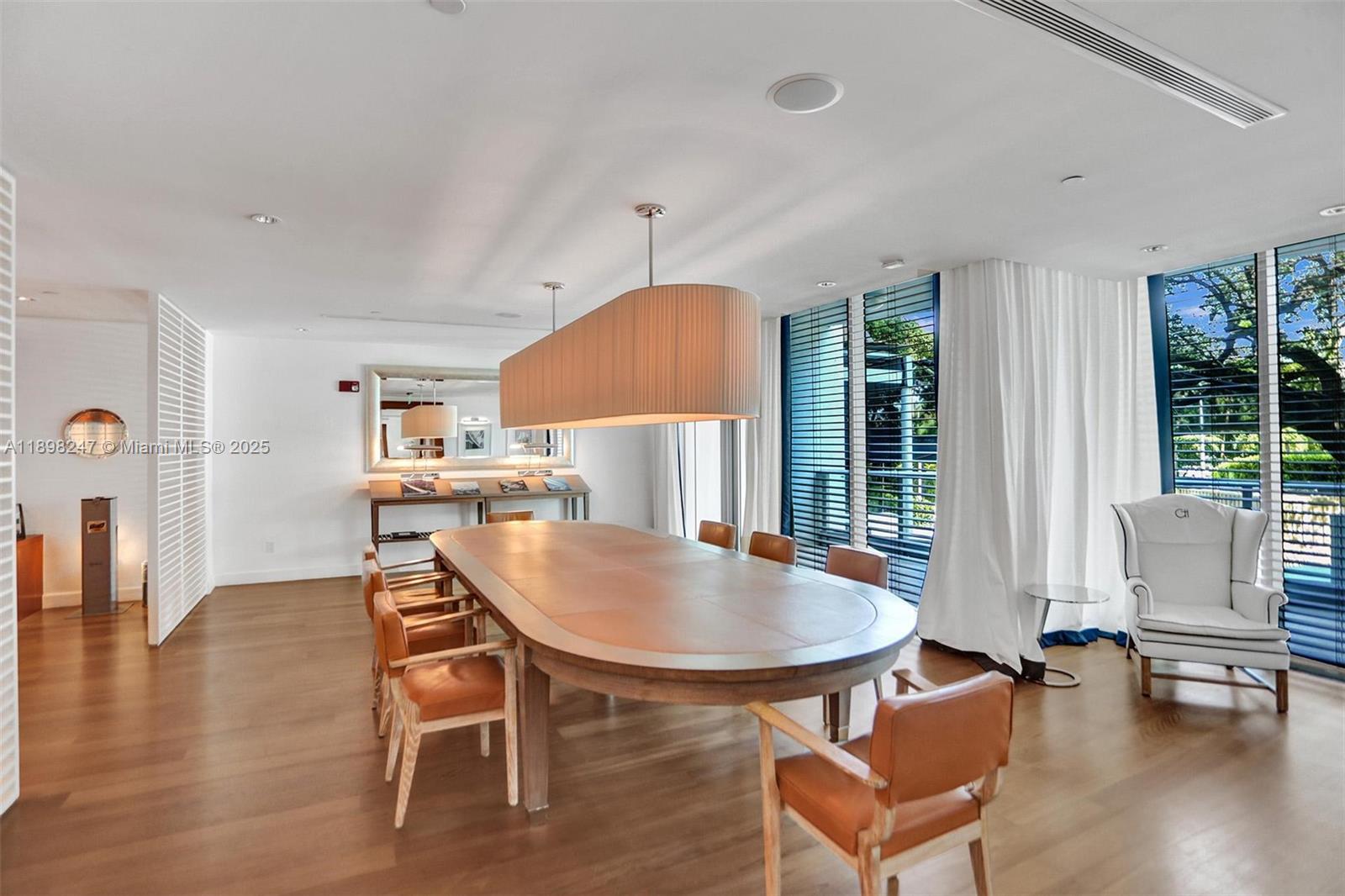2627 South Bayshore Drive, Unit 506 Coconut Grove, FL 33133 - Photo 53 of 61 a dining room with furniture and wooden floor