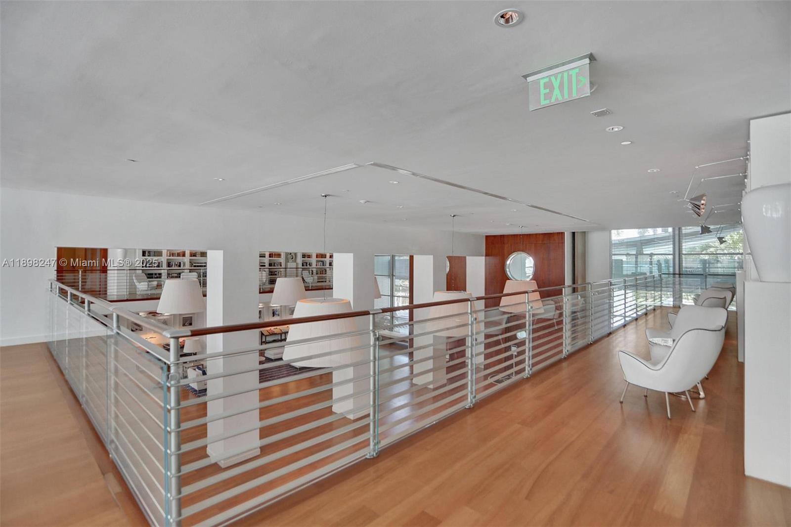 2627 South Bayshore Drive, Unit 506 Coconut Grove, FL 33133 - Photo 54 of 61 a living room with furniture and wooden floor