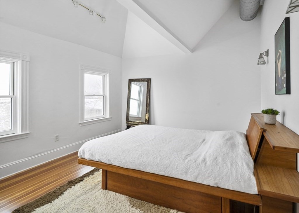 98 Electric Avenue, Unit 3 Somerville, MA 02144 - Photo 8 of 16 a bedroom with a bed and window