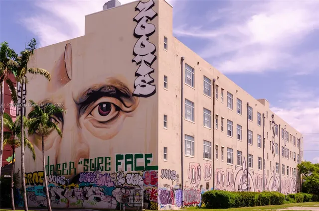 a front view of a building with entryway and a street