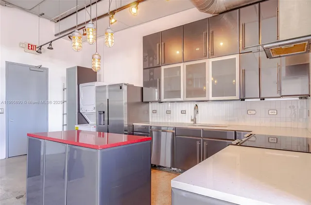 a kitchen with a sink and cabinets