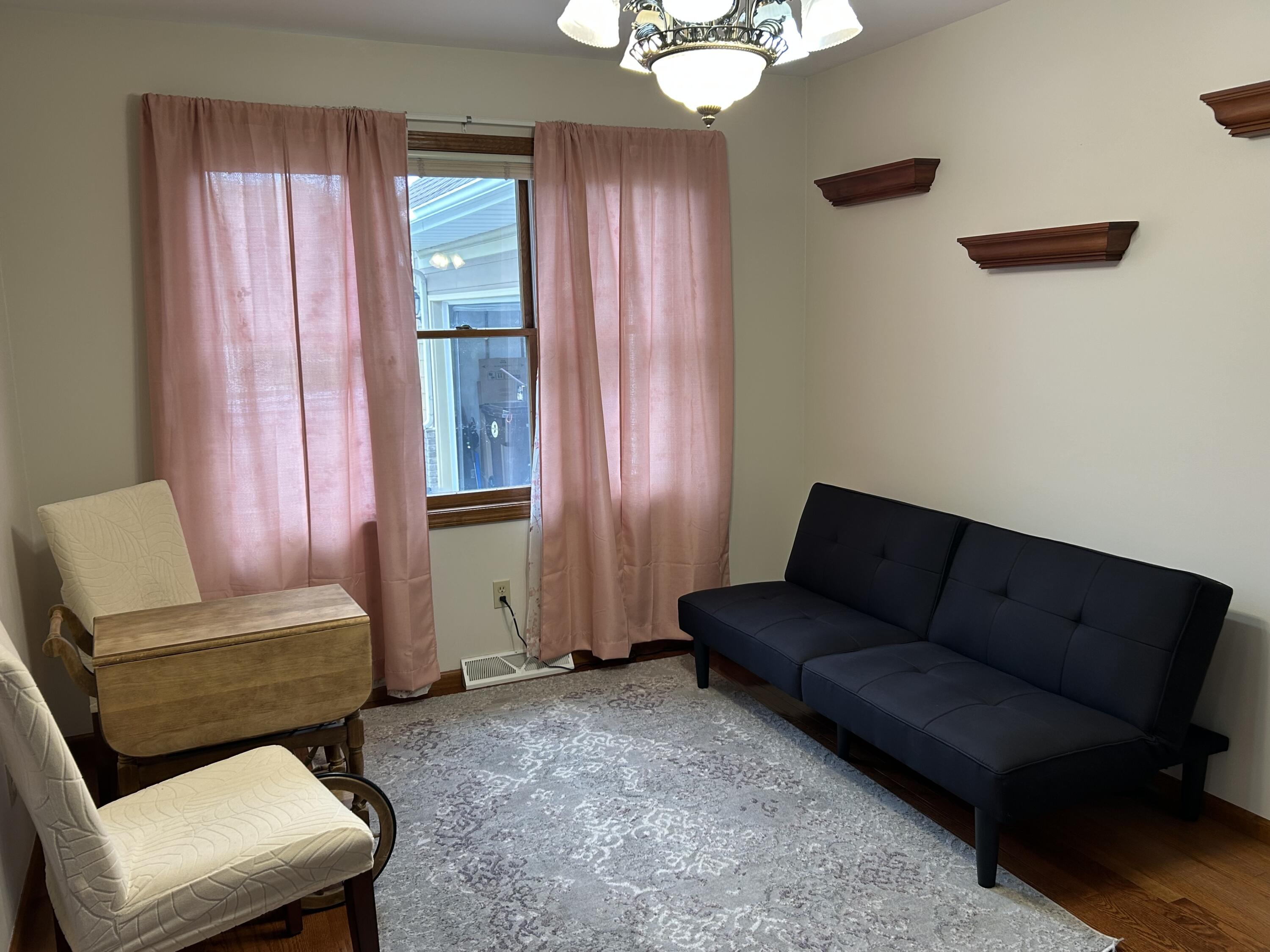 8876 North Lilac Street Demotte, IN 46310 - Photo 12 of 23 a living room with furniture and a window