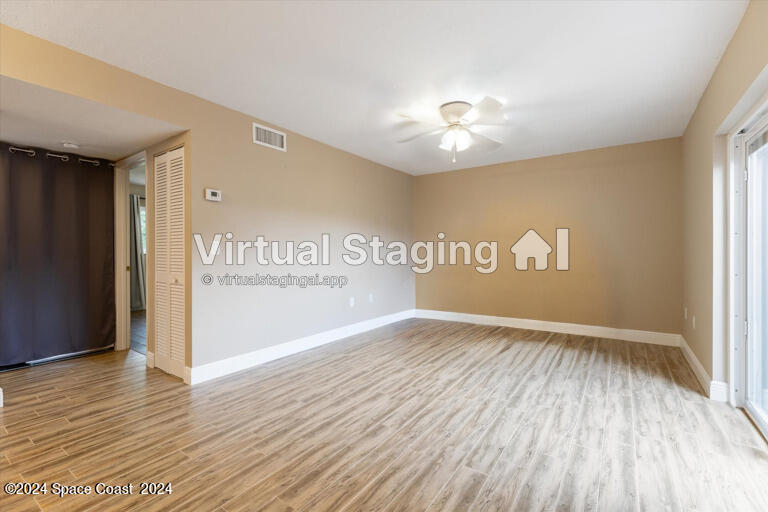 712 Ridge Club Drive Melbourne, FL 32934 - Photo 20 of 32 a view of an empty room with wooden floor
