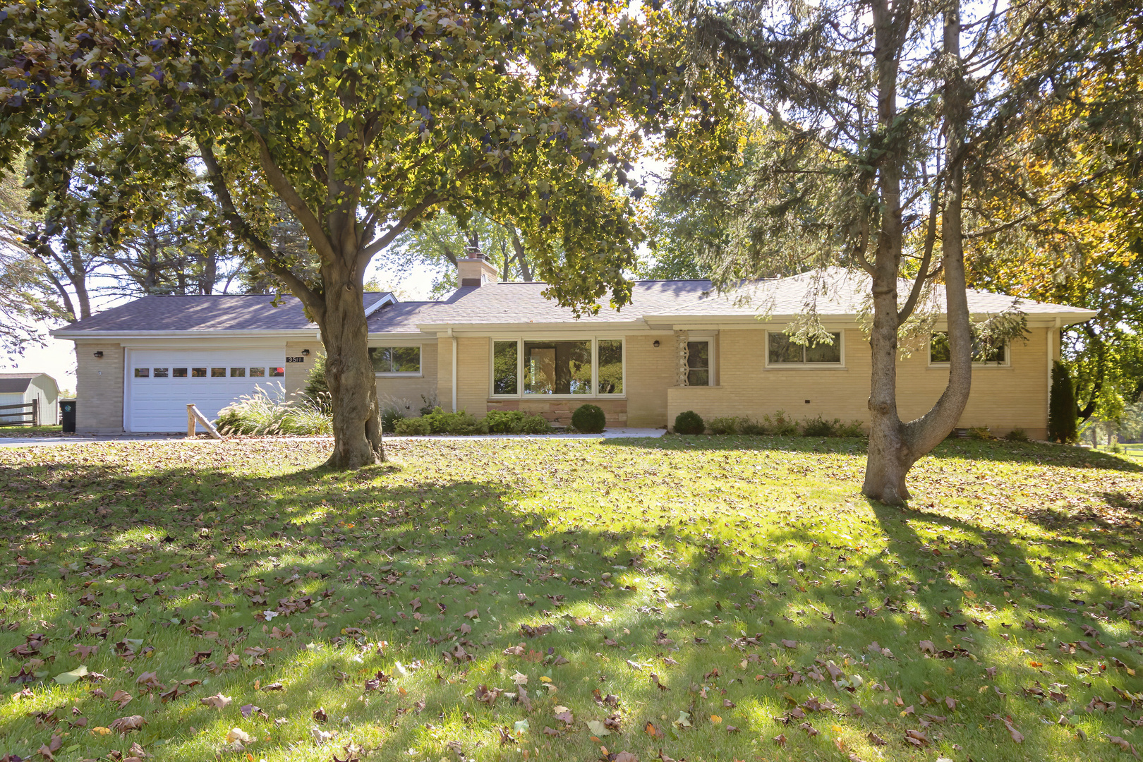 3511 West Gracy Road McHenry, IL 60050 - Photo 1 of 49 a front view of a house with a yard