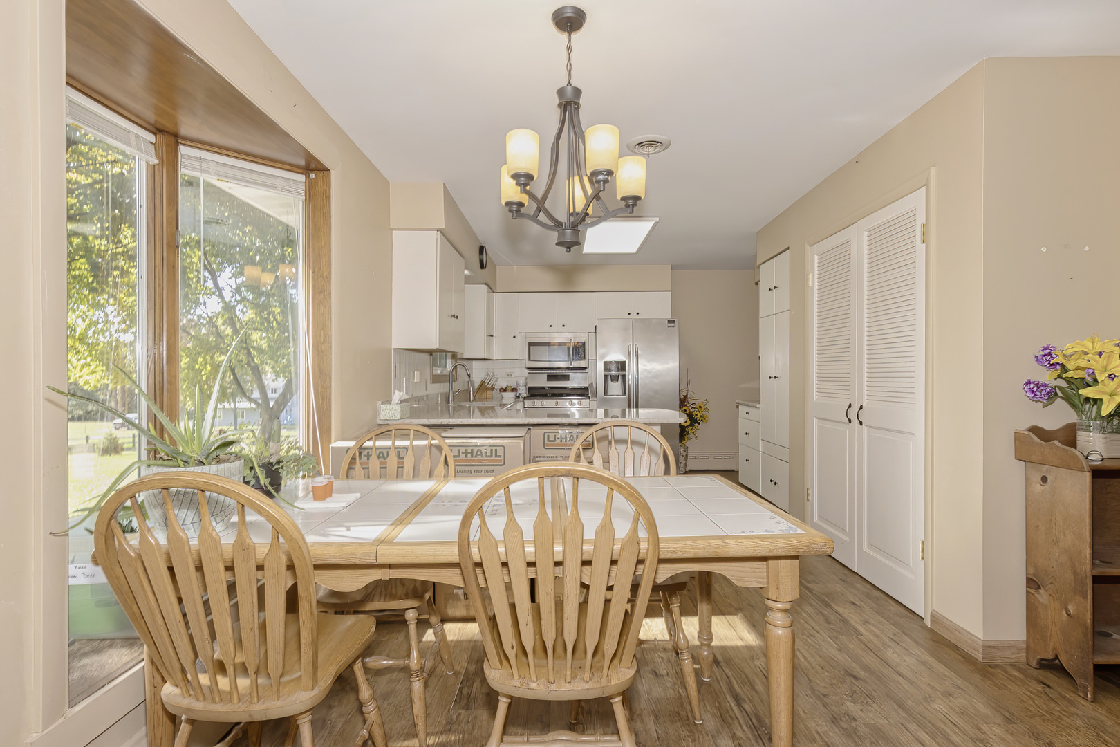 3511 West Gracy Road McHenry, IL 60050 - Photo 13 of 49 a view of a dining room with furniture window and wooden floor