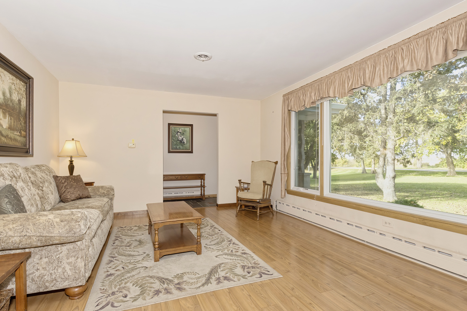 3511 West Gracy Road McHenry, IL 60050 - Photo 15 of 49 a living room with furniture and a large window with outer view
