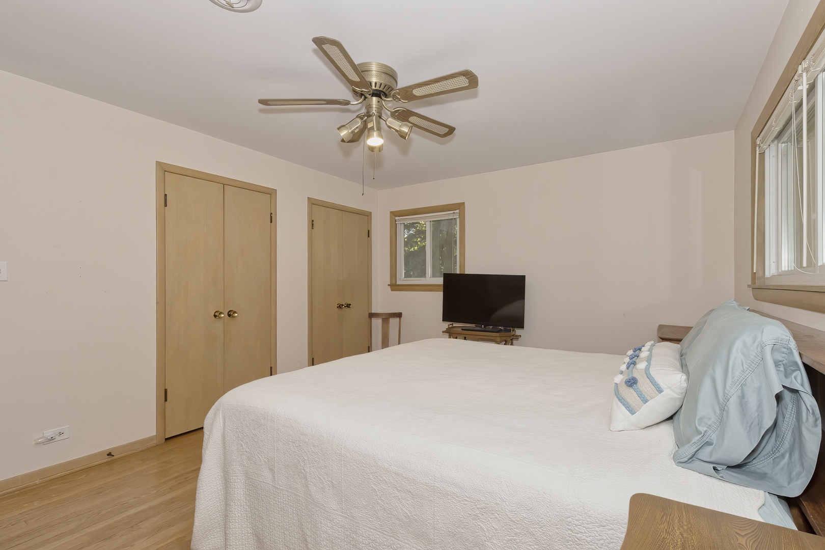 3511 West Gracy Road McHenry, IL 60050 - Photo 18 of 49 a bedroom with a bed and a chandelier